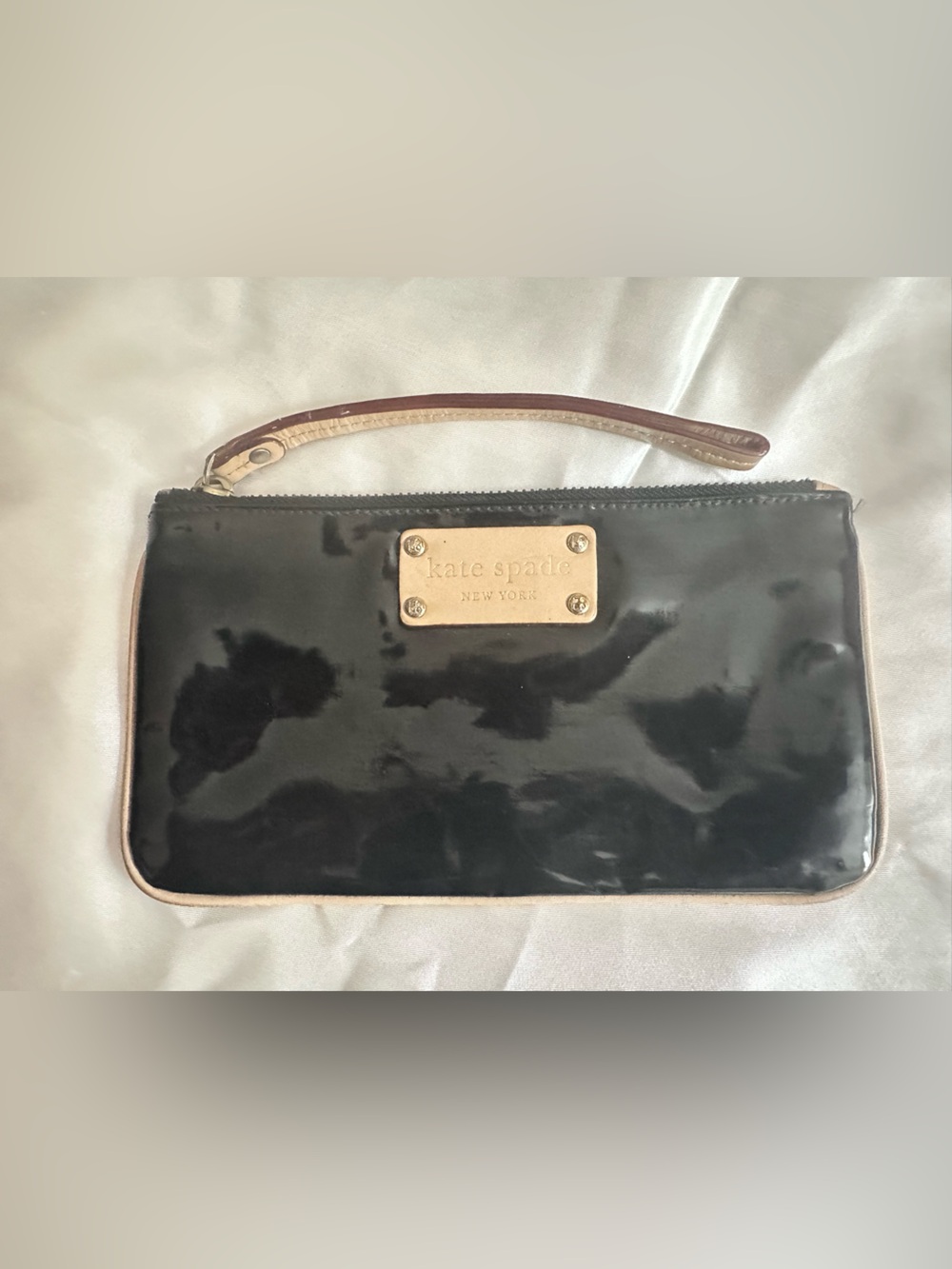 Kate Spade Black Patent Wristlet with Beige Trim and Gold Plaque